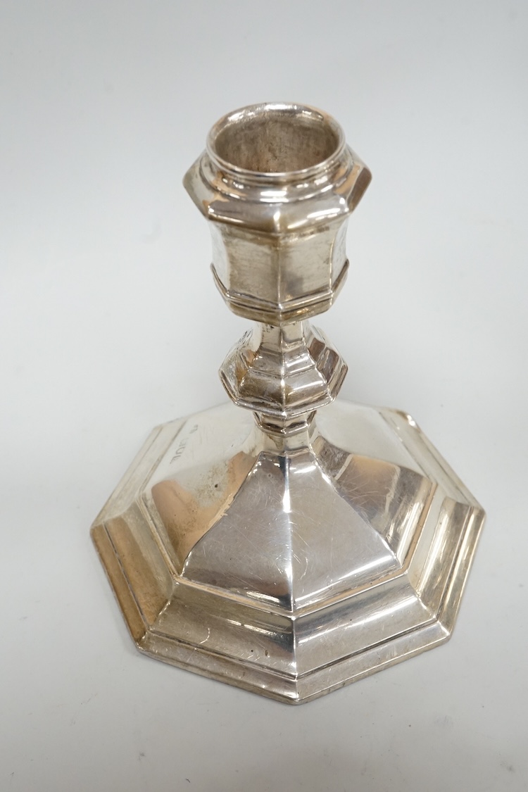 A pair of Edwardian silver mounted octagonal dwarf candlesticks by William Hutton & Sons, London, 1905, 12.7cm, weighted, one lacking sconce, together with a silver pin tray a continental sugar bowl with glass liner and